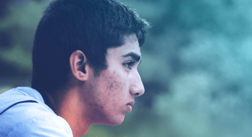depression young boy looking looking directly ahead